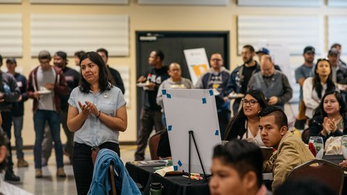 People clapping in a room